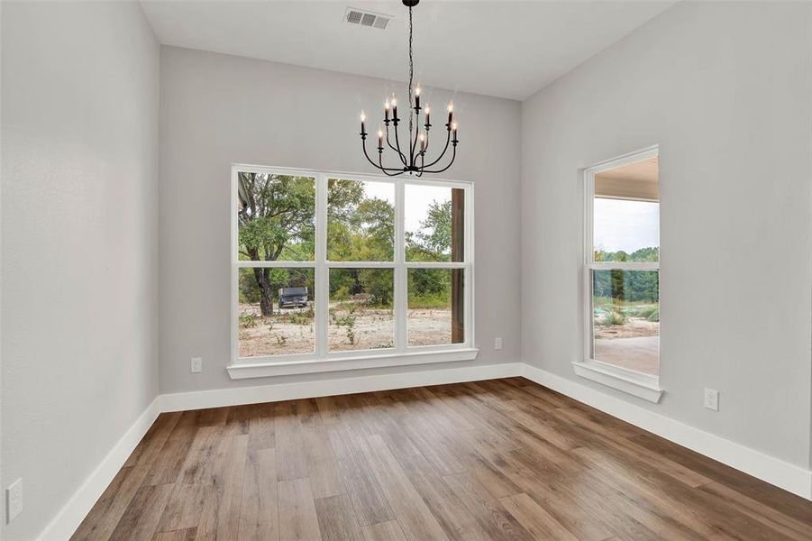 Dining space overlooks acreage