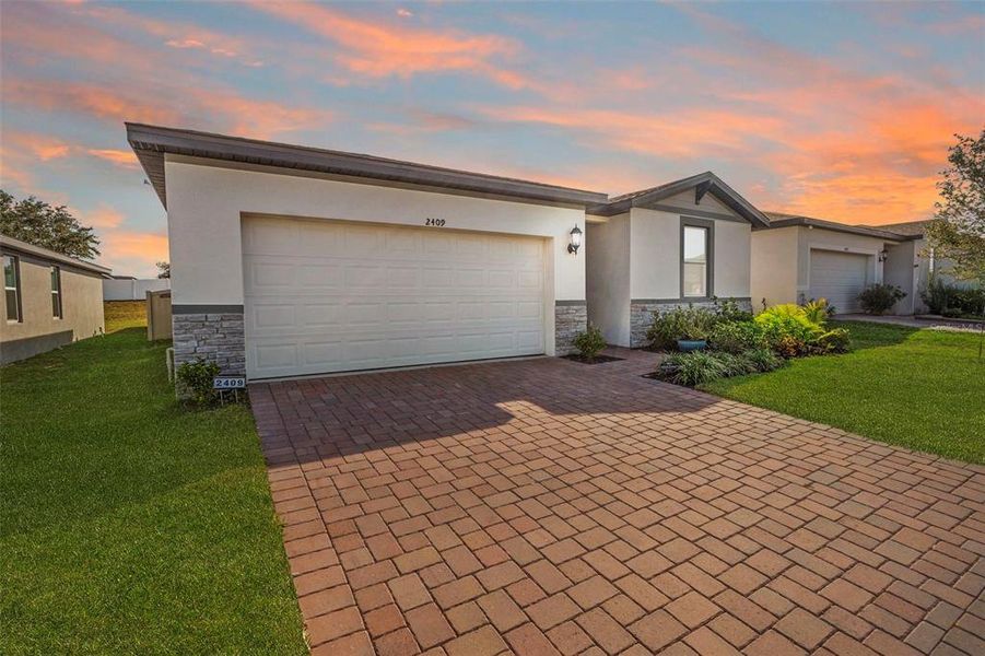 Exterior details and patio area of a home in Deer Run at Crosswinds, Davenport (Image 3).