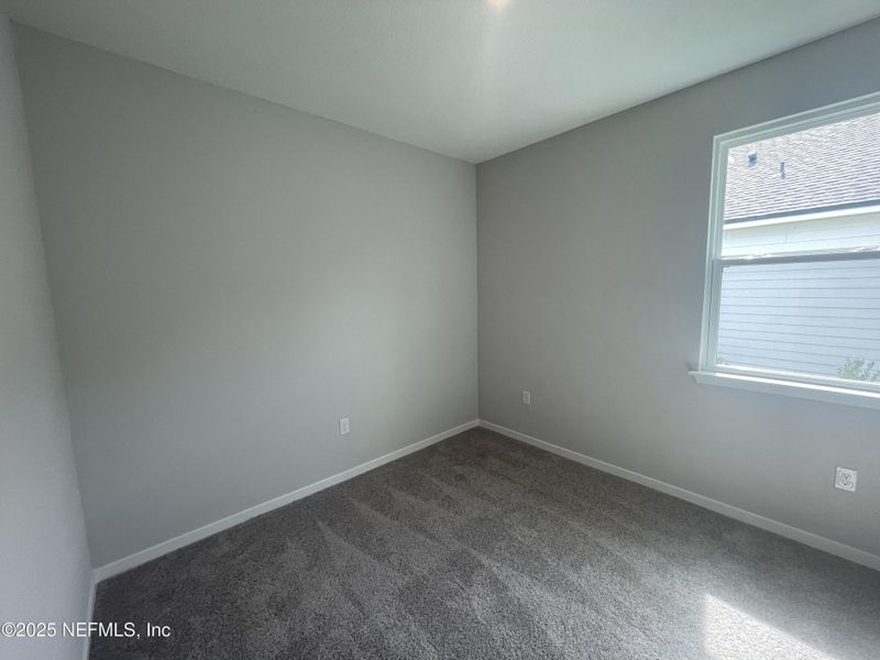 Spacious, unfurnished interior of a new home in Palm Series at Seminole Palms, Palm Coast (Image 18).