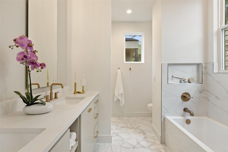 Full bathroom with shower / bathing tub combination, toilet, and vanity