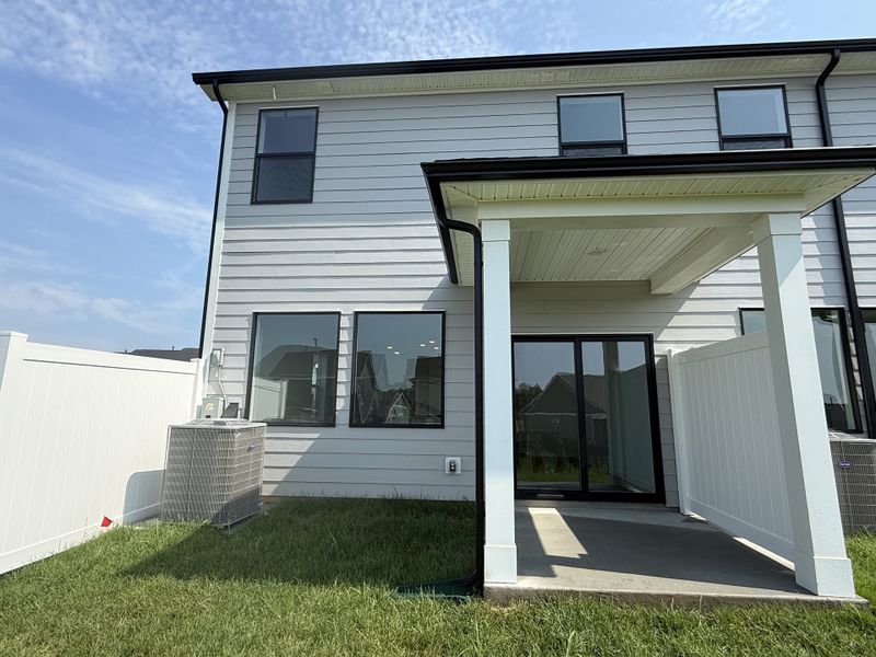 Exterior details and patio area of a home in Nexus Townhomes, Gallatin (Image 3).