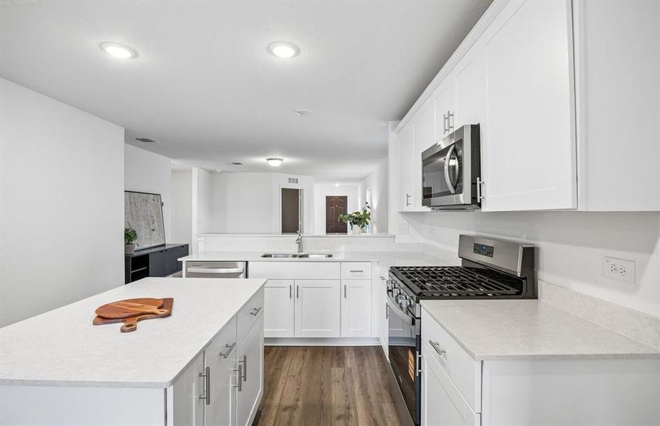 *Model Representation - Large island overlooking gathering room and dining areas
