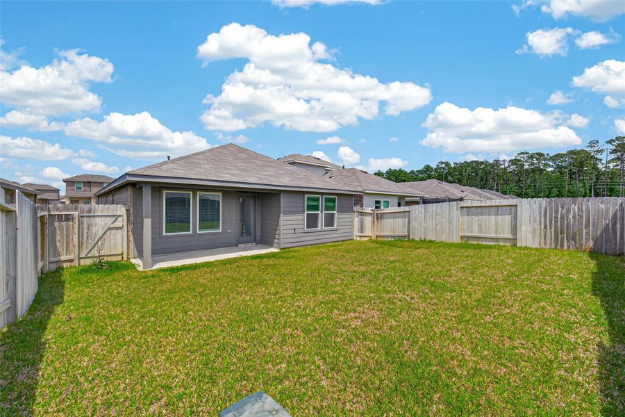 Exterior details and patio area of a home in Breckenridge Forest, Spring (Image 28).