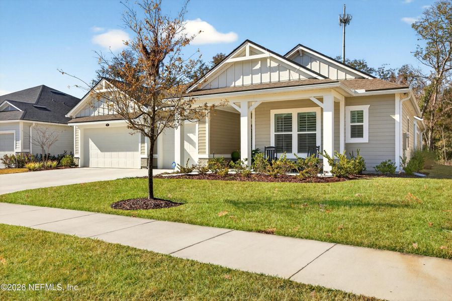 Front exterior of a new home in RiverTown, St. Johns, FL, highlighting curb appeal (Image 24).