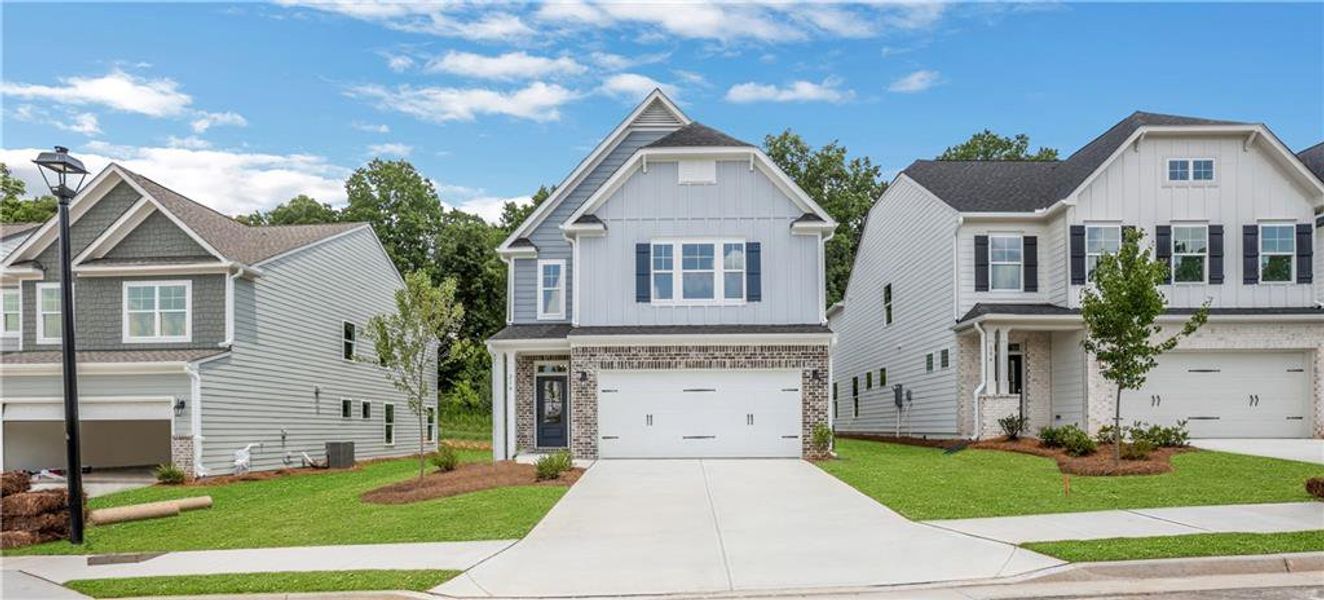 Front exterior of a new home in Villas at Dawsonville, Dawsonville, GA, highlighting curb appeal (Image 22). Front exterior of a new home in Villas at Dawsonville, Dawsonville, GA, highlighting curb appeal (Image 22).