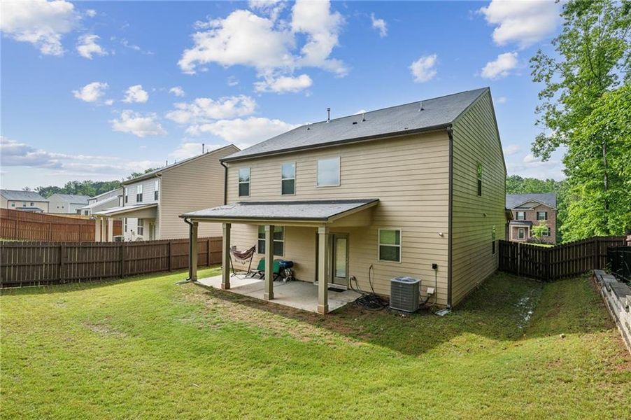 Exterior details and patio area of a home in The Enclave at Flat Rock Hills, Stonecrest (Image 3).