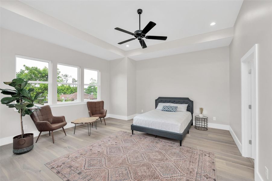 Primary bedroom overlooking backyard