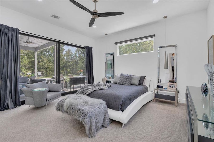 Carpeted bedroom with recessed lighting and a ceiling fan