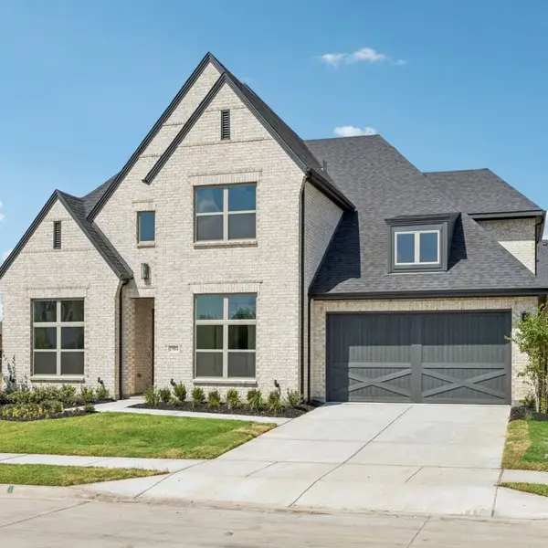 Front exterior of a new home in The Parks at Wilson Creek, Celina, TX, highlighting curb appeal (Image 26). Front exterior of a new home in The Parks at Wilson Creek, Celina, TX, highlighting curb appeal (Image 26).
