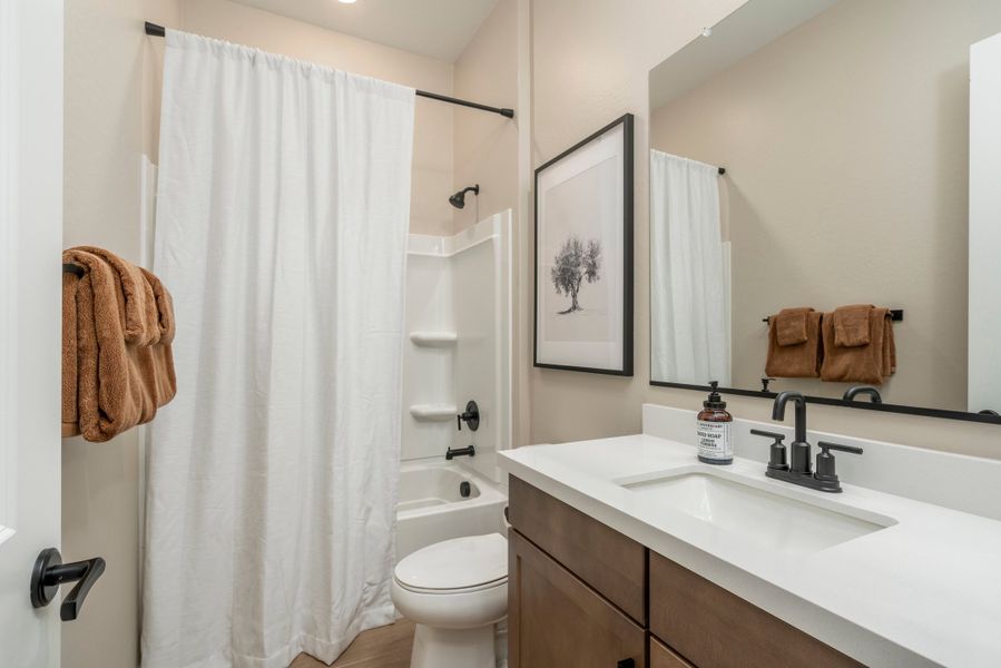 Representative furnished interior of a home built from the Falcon by Risewell Homes in Citrus Park, Goodyear (Image 14).
