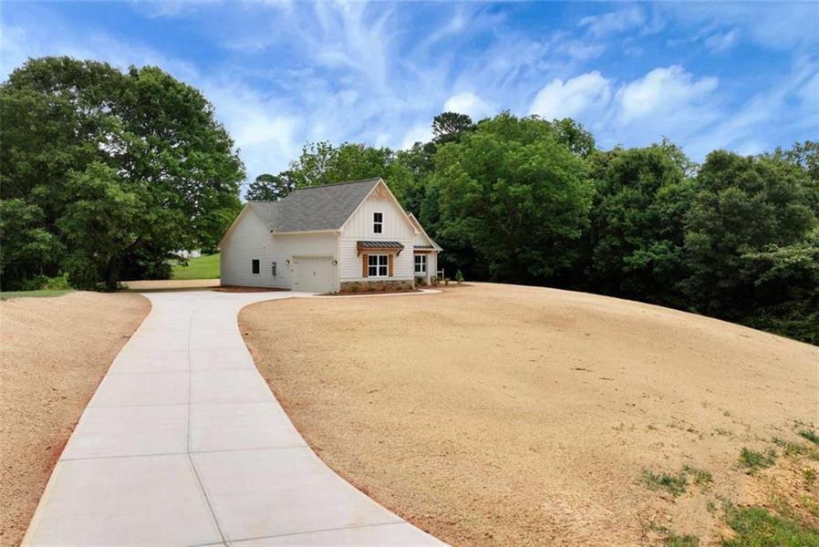 Front exterior of a new home in , Maysville, GA, highlighting curb appeal (Image 23).