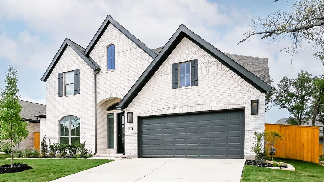 Front exterior of a new home in 6 Creeks, Kyle, TX, highlighting curb appeal (Image 20).