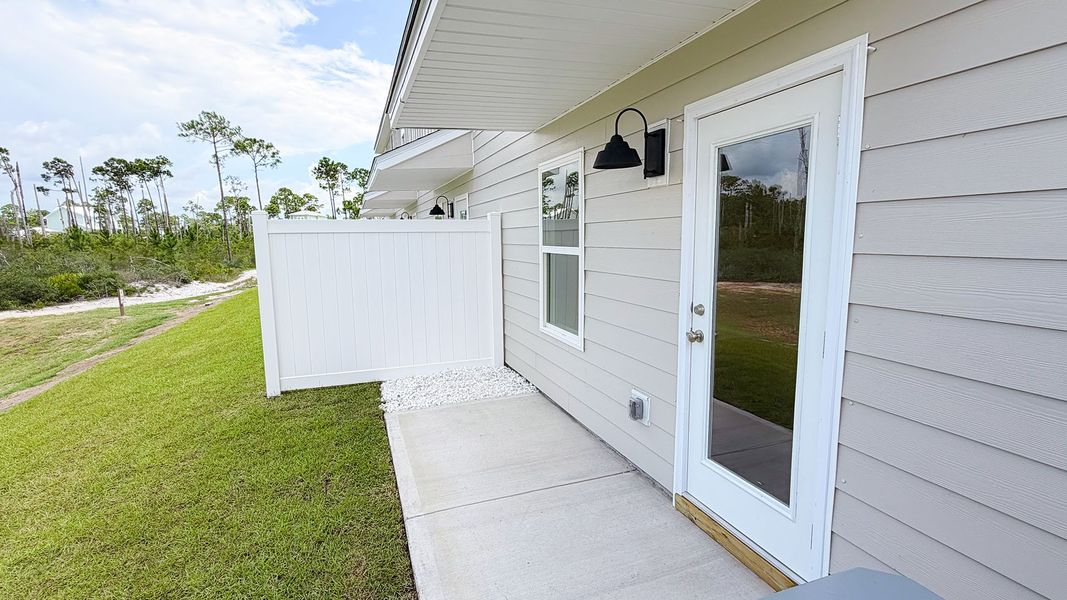 Exterior details and patio area of a home in WindMark Beach, Port Saint Joe (Image 21).
