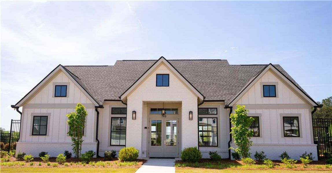 Front exterior of a new home in , Woodstock, GA, highlighting curb appeal (Image 21).
