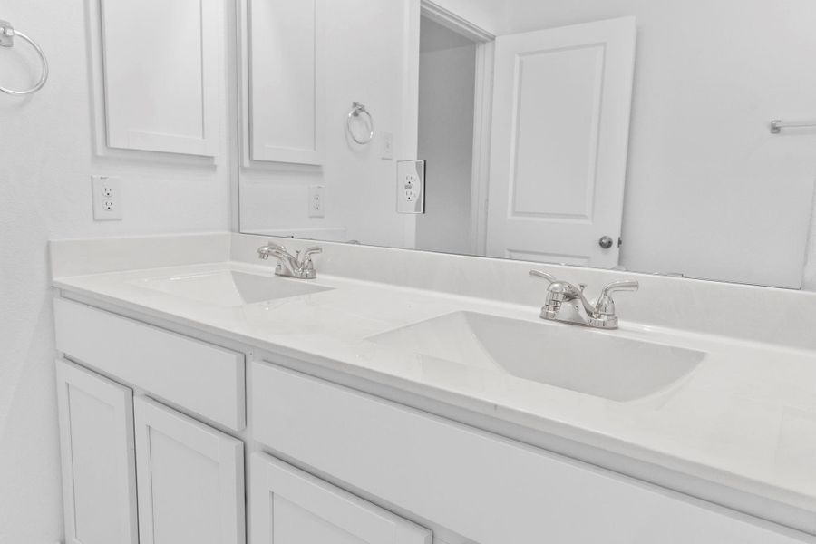 Close-up of the dual sink vanity, perfect for busy mornings or relaxing evening routines. **Image Representative of Plan Only and May Vary as Built**.