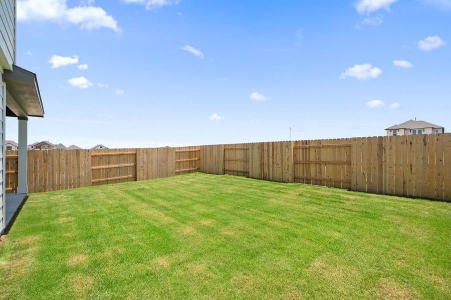 Exterior details and patio area of a home in Lariat, Liberty Hill (Image 28).