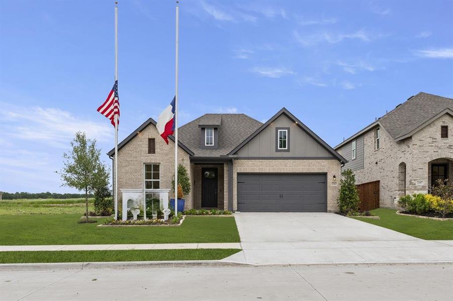 Front exterior of a new home in Walden Pond, Forney, TX, highlighting curb appeal (Image 1).