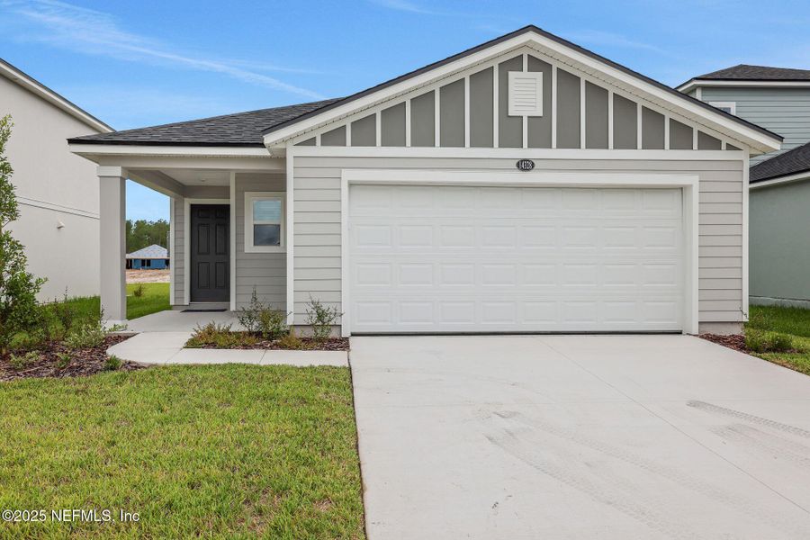 Front exterior of a new home in Bellbrooke, Jacksonville, FL, highlighting curb appeal (Image 11).
