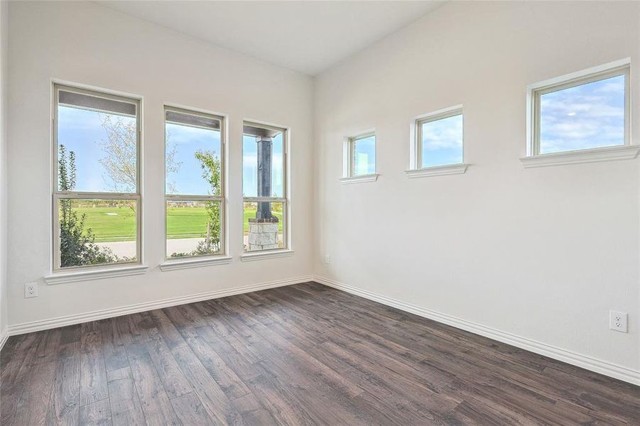 Unfurnished room featuring dark hardwood / wood-style floors