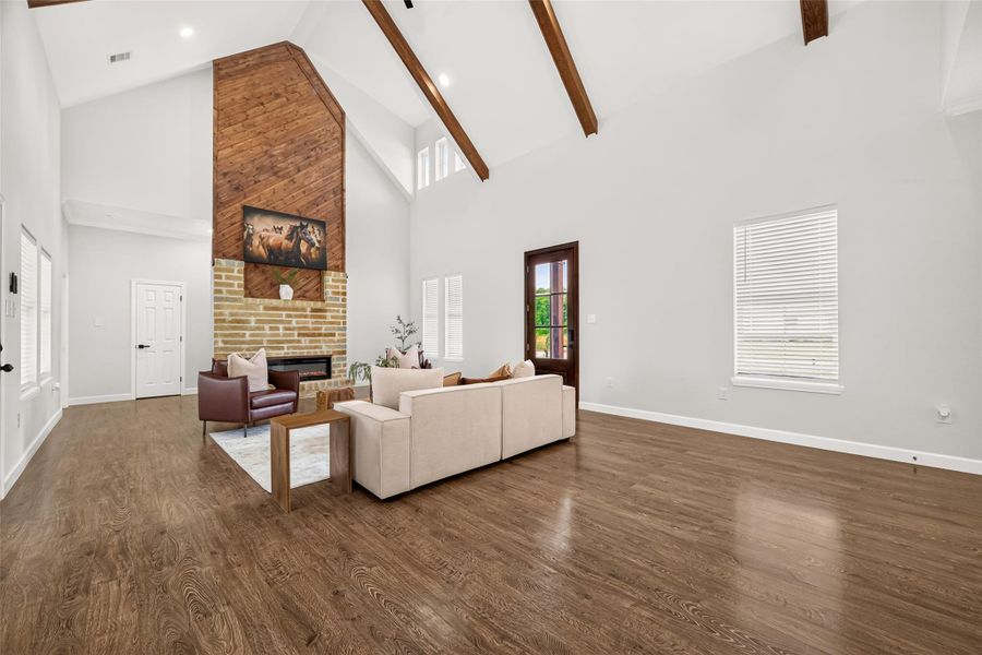 Stunning open living room with soaring ceilings, modern farmhouse finishes, and plenty of space to gather.