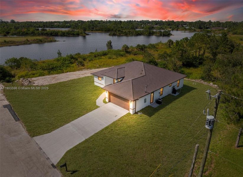 Front exterior of a new home in , Lehigh Acres, FL, highlighting curb appeal (Image 18).