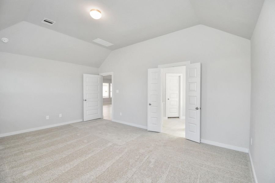 Escape and relax in the exquisite primary suite, a haven to unwind after a long day. The spacious room, boasts plush carpeting, soothing paint tones, high ceilings, and expansive windows adorned with privacy blinds. Sample photo of completed home with similar floor plan. Actual colors and selections may vary. Escape and relax in the exquisite primary suite, a haven to unwind after a long day. The spacious room, boasts plush carpeting, soothing paint tones, high ceilings, and expansive windows adorned with privacy blinds. Sample photo of completed home with similar floor plan. Actual colors and selections may vary.