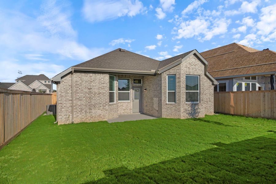 Exterior details and patio area of a home in Bridgeland, Cypress (Image 19).