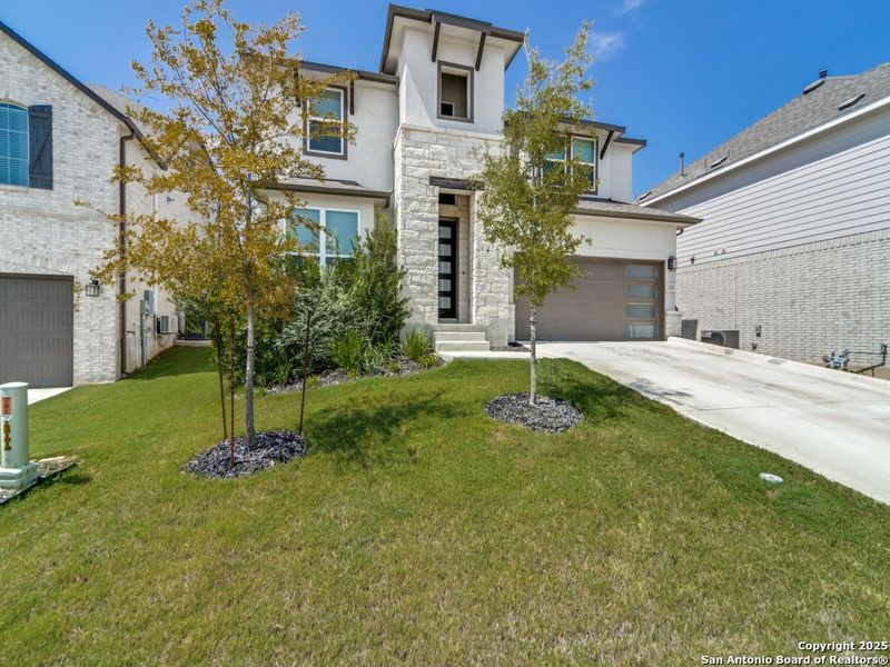 Front exterior of a new home in Regent Park, Boerne, TX, highlighting curb appeal (Image 18).