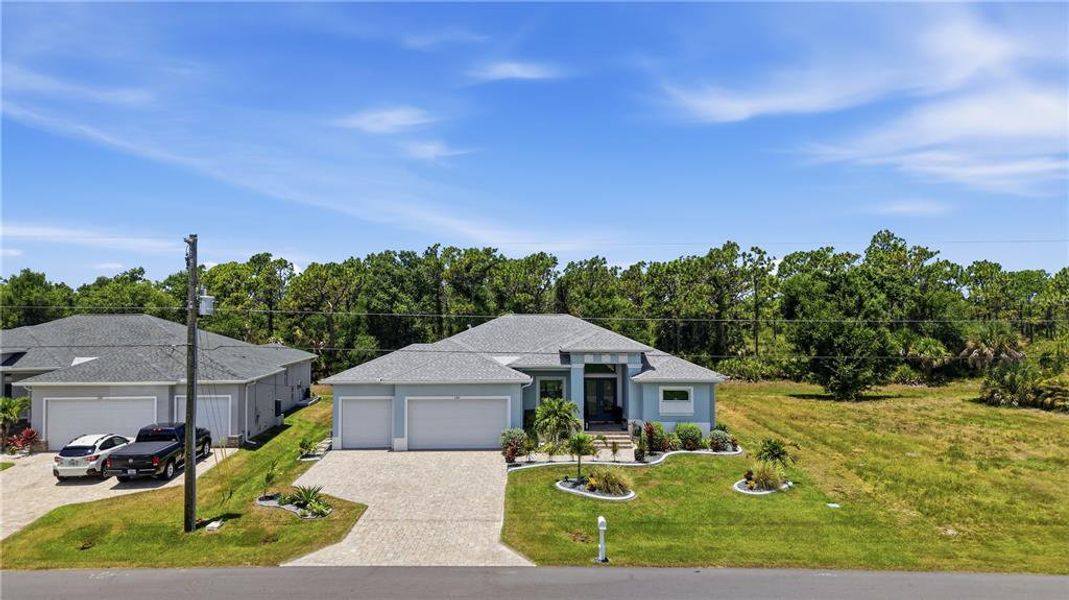 Front exterior of a new home in , Rotonda West, FL, highlighting curb appeal (Image 20).