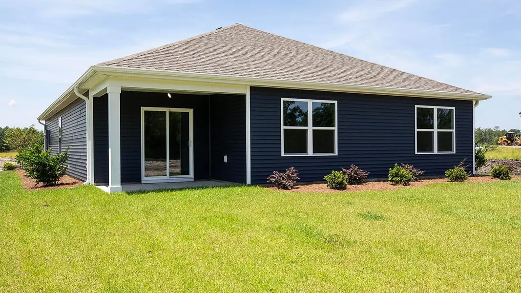 Exterior details and patio area of a home in Cedar Hill Landing, Navassa (Image 3).