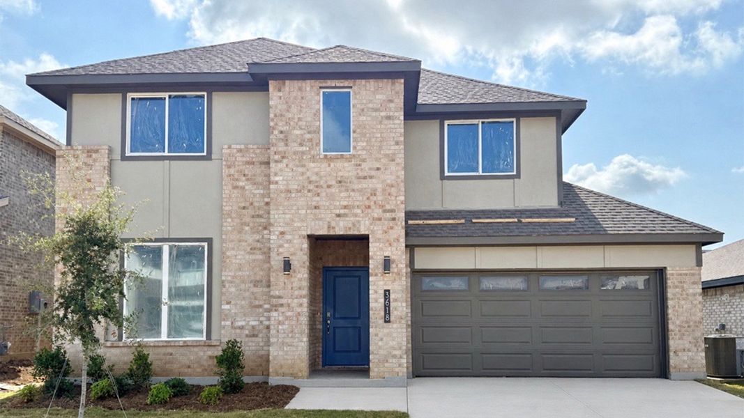 Representative exterior photo of a completed home built from the Holly by D.R. Horton in The Preserve at Forum, Grand Prairie, TX (Image 20). Representative exterior photo of a completed home built from the Holly by D.R. Horton in The Preserve at Forum, Grand Prairie, TX (Image 20).