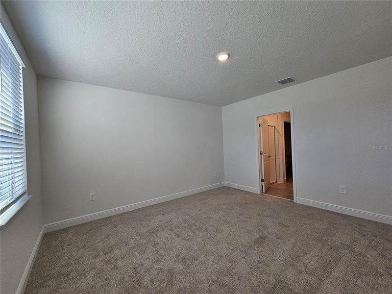 Spacious, unfurnished interior of a new home in The Reserve at Hammock Oaks - Classic Series, Lady Lake (Image 36).