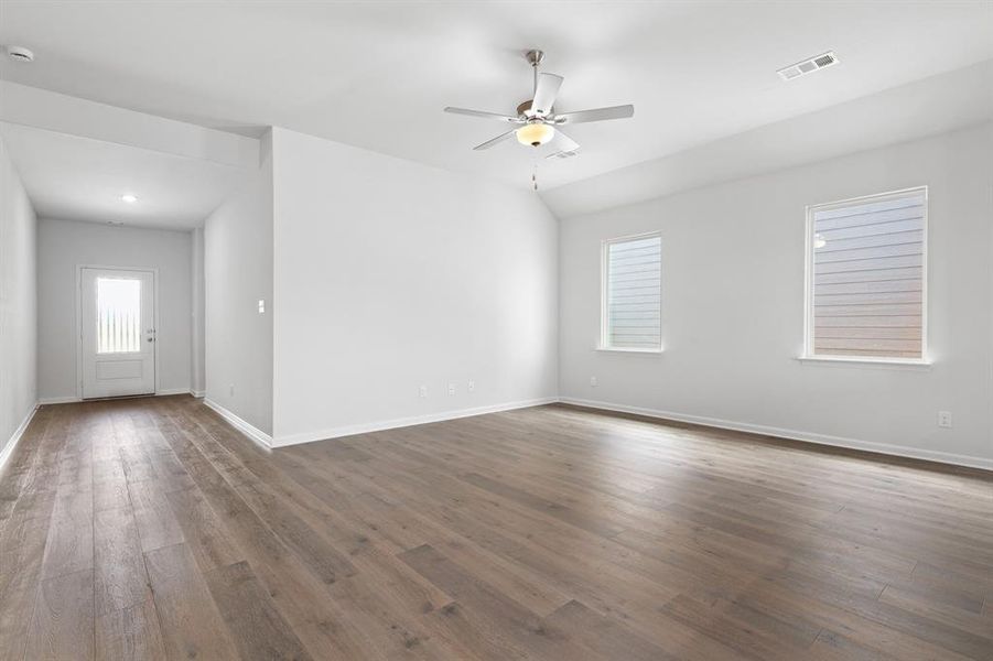 Empty room with hardwood / wood-style floors and a ceiling fan Empty room with hardwood / wood-style floors and a ceiling fan
