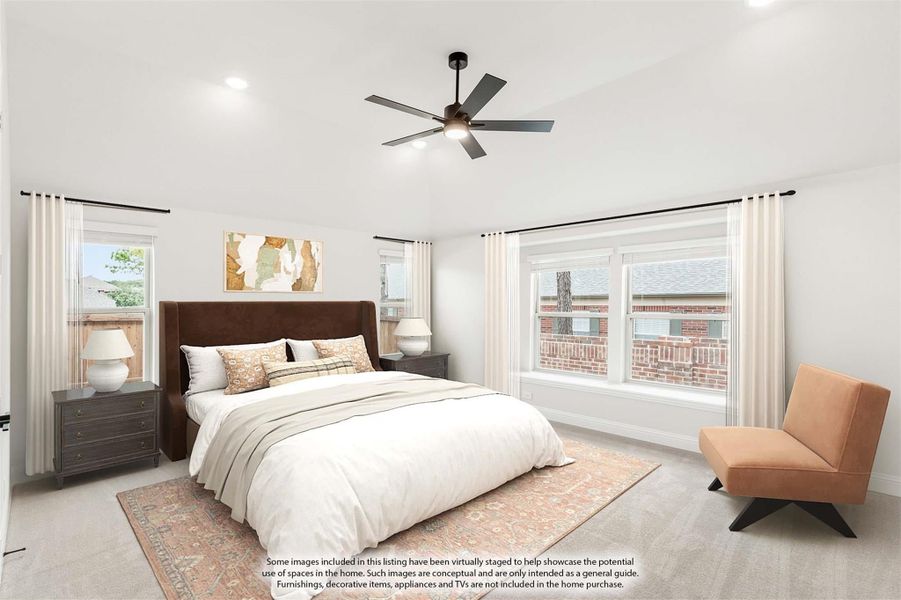 Spacious bedroom with king bed, ceiling fan, carpet flooring, and multiple windows with white curtains