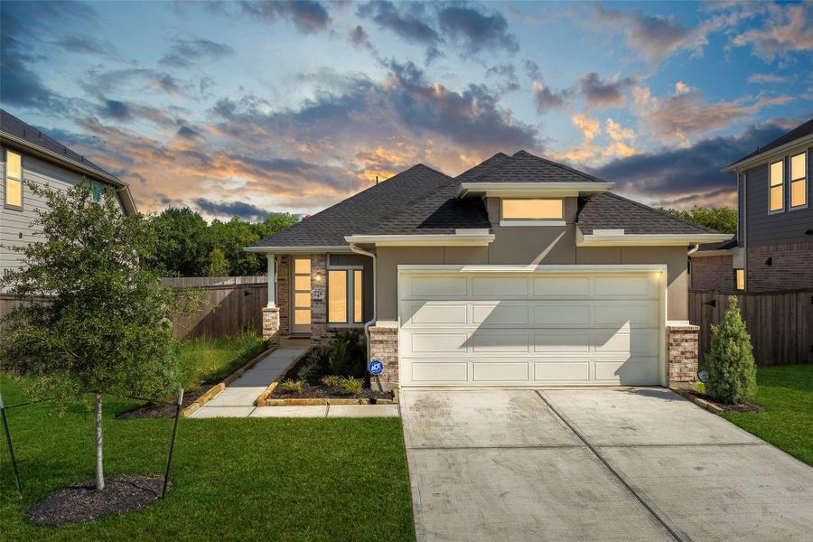 Front exterior of a new home in Laurel Landing, Alvin, TX, highlighting curb appeal (Image 2).