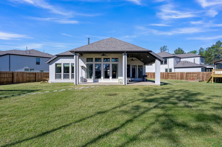 Large covered back porch made for relaxing, gathering, and enjoying this amazing outdoor space! Large covered back porch made for relaxing, gathering, and enjoying this amazing outdoor space!
