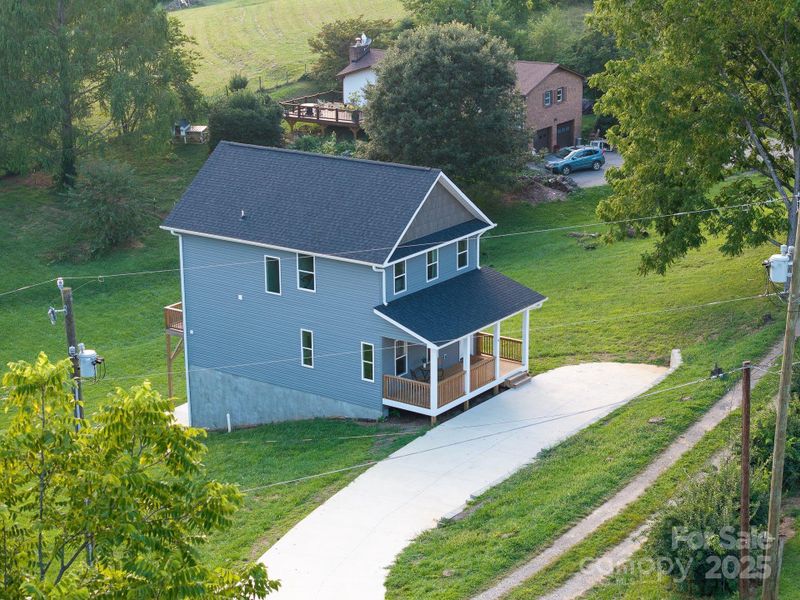 Front exterior of a new home in , Asheville, NC, highlighting curb appeal (Image 27).