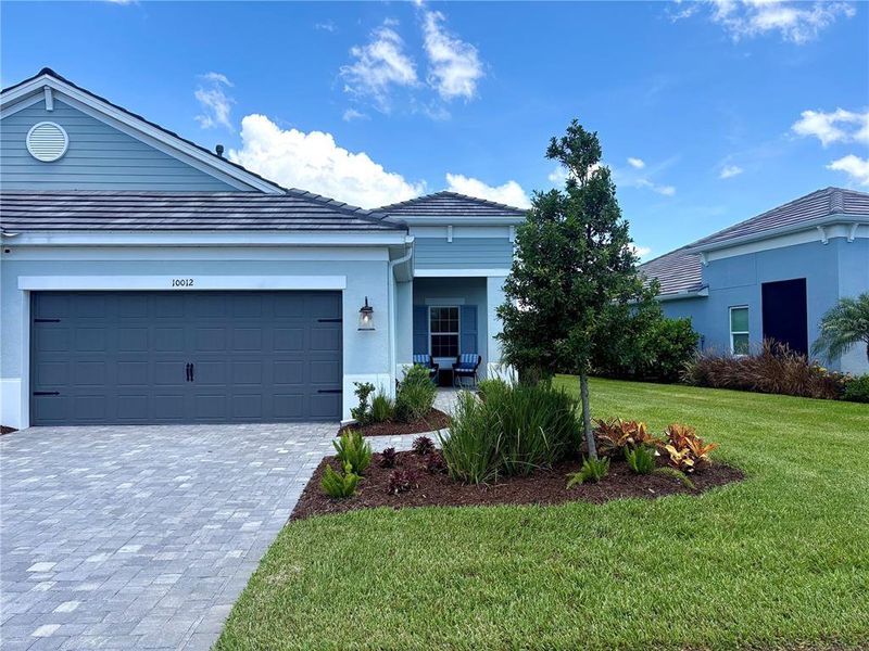 Front exterior of a new home in , Sarasota, FL, highlighting curb appeal (Image 1). Front exterior of a new home in , Sarasota, FL, highlighting curb appeal (Image 1).