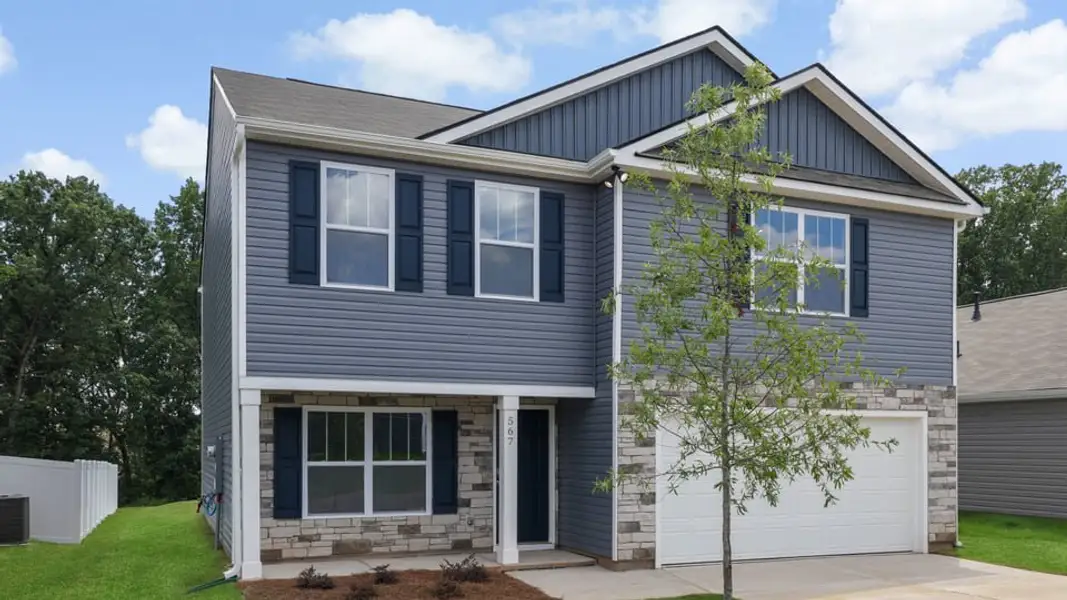 Front exterior of a new home in Lakestone, Woodruff, SC, highlighting curb appeal (Image 2). Front exterior of a new home in Lakestone, Woodruff, SC, highlighting curb appeal (Image 2).