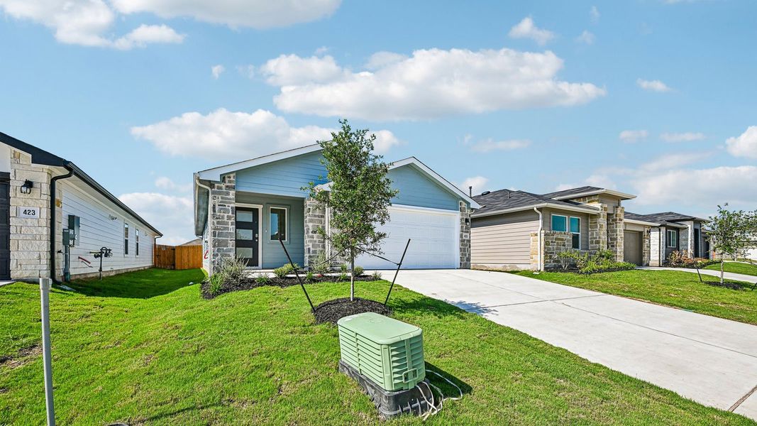 Front exterior of a new home in Southgrove, Kyle, TX, highlighting curb appeal (Image 25).