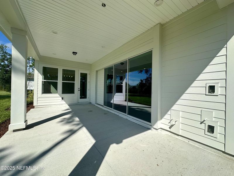 Front exterior of a new home in SilverLeaf, St. Augustine, FL, highlighting curb appeal (Image 18). Front exterior of a new home in SilverLeaf, St. Augustine, FL, highlighting curb appeal (Image 18).