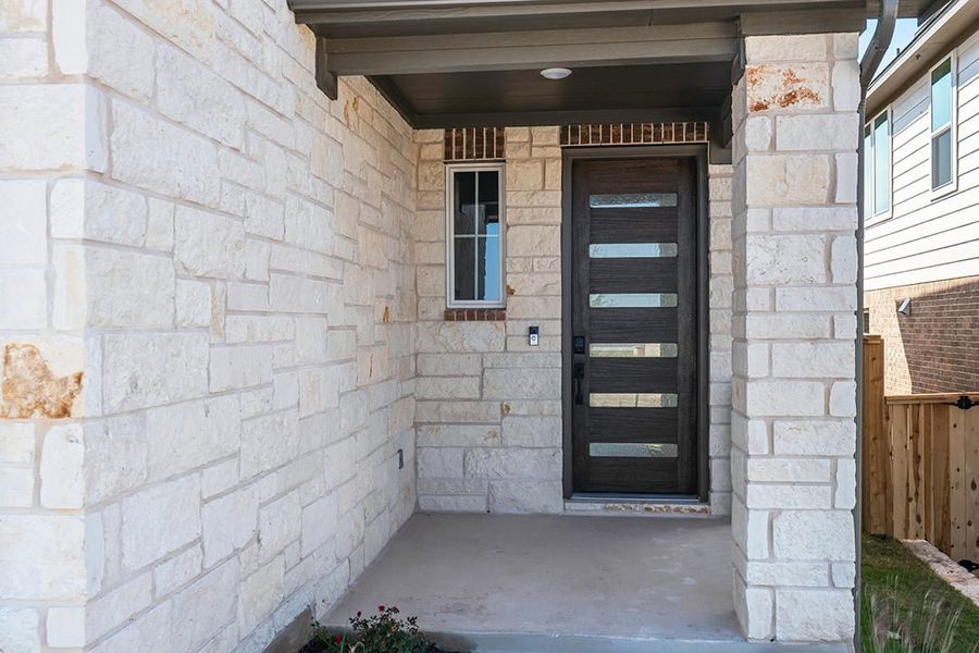 Exterior details and patio area of a home in Terrace Collection at Lariat, Liberty Hill (Image 3). Exterior details and patio area of a home in Terrace Collection at Lariat, Liberty Hill (Image 3).