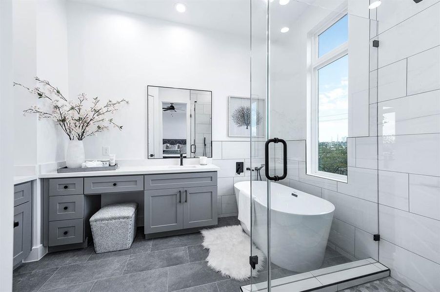 Beautiful shot of the primary bathroom. Dual vanity, soaking tub, surround glass shower.