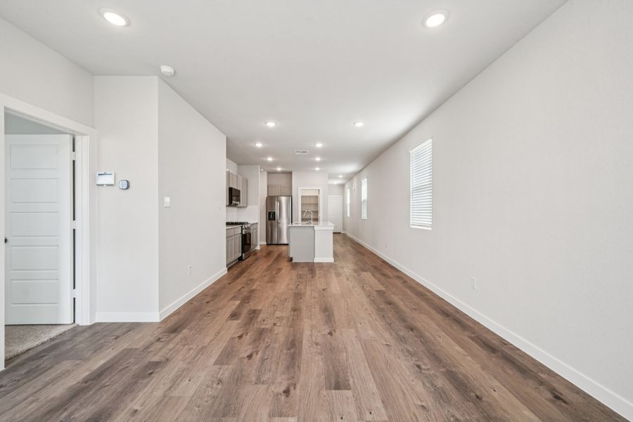 A long hallway with white walls.