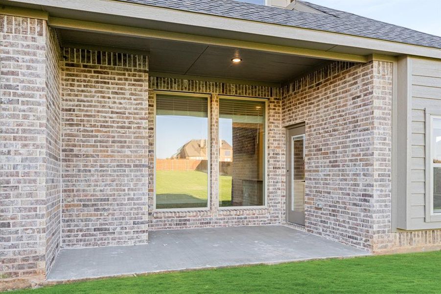 Exterior details and patio area of a home in Coyote Crossing, Godley (Image 3).