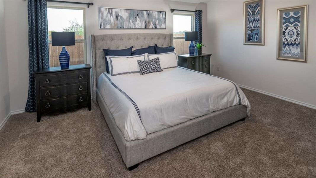 Carpeted bedroom with baseboards