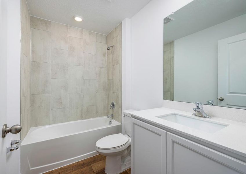 Each of the full baths have a beautiful vanity with a tub