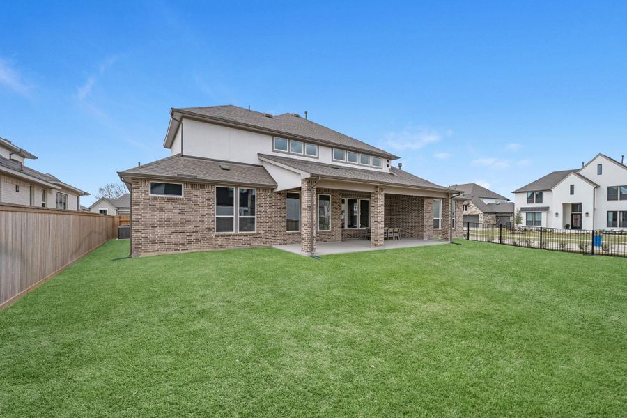 Exterior details and patio area of a home in Bridgeland, Cypress (Image 3).