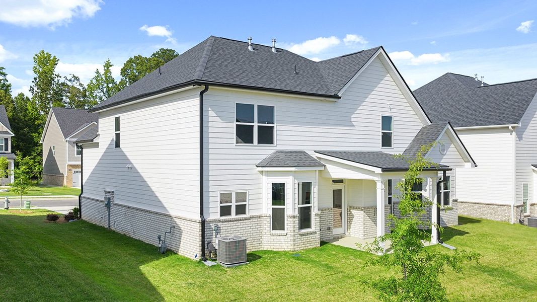 Front exterior of a new home in Wildwood, Covington, GA, highlighting curb appeal (Image 26). Front exterior of a new home in Wildwood, Covington, GA, highlighting curb appeal (Image 26).
