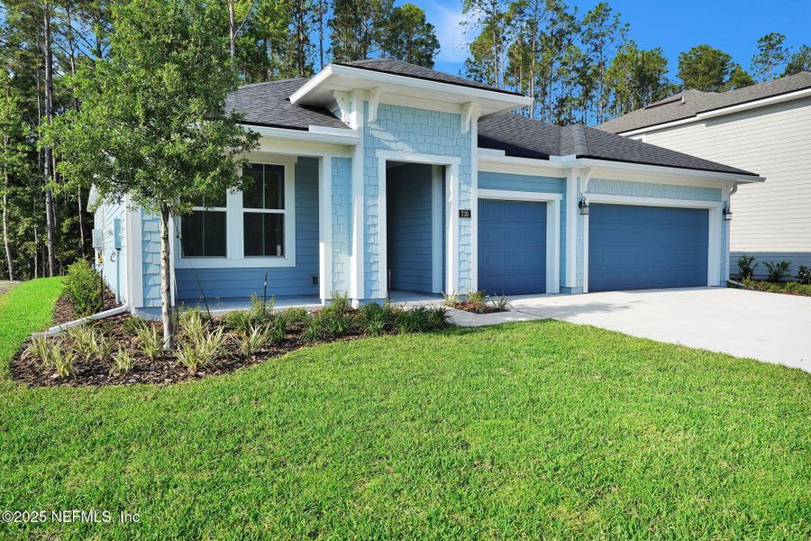 Front exterior of a new home in Trailmark - Phase 10, St. Augustine, FL, highlighting curb appeal (Image 1).